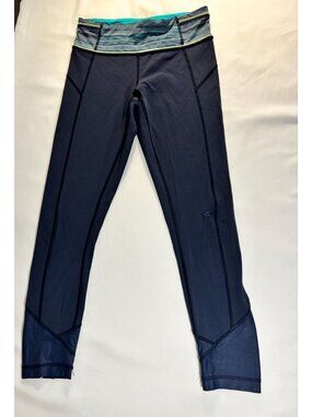 Lululemon navy high-rise leggings with teal waistband detail size (estimated 4–6